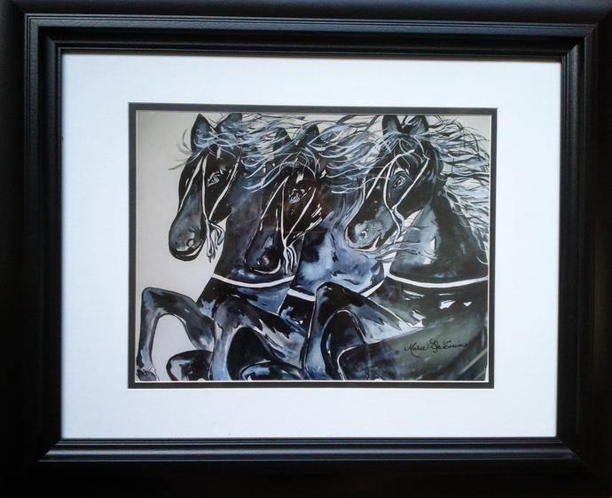 Framed artwork of three black stallion horses