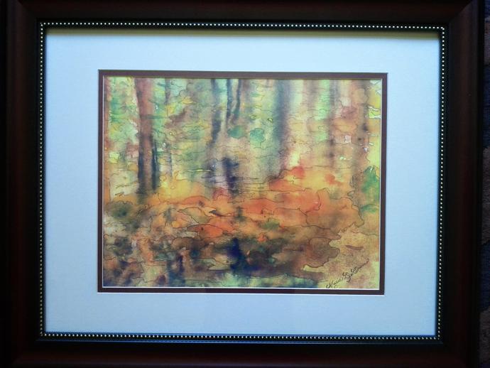 Framed artwork of a fall forest
