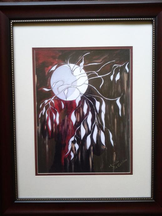 Framed artwork of the moon shining behind a tree