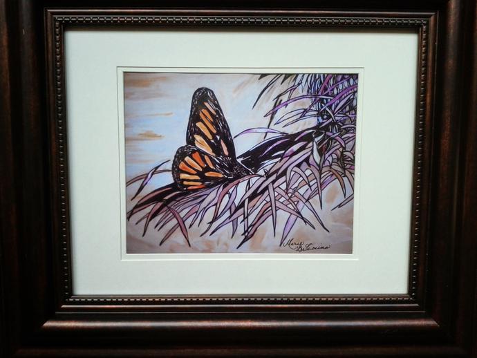 Framed artwork of a monarch butterfly landing on a purple plant