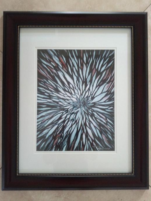 Framed artwork of a thousand strokes creating a flower